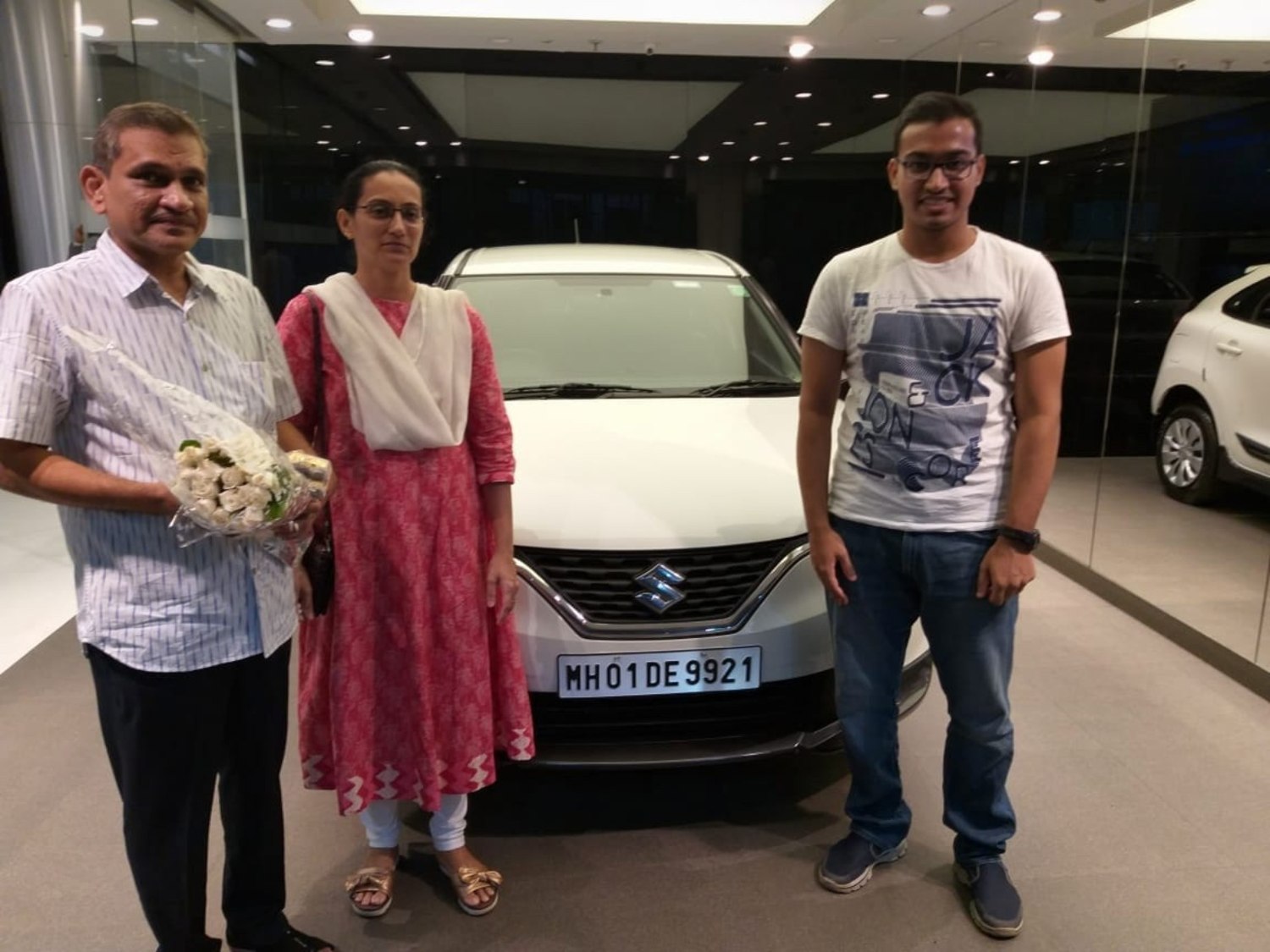 A family photo together beside our car